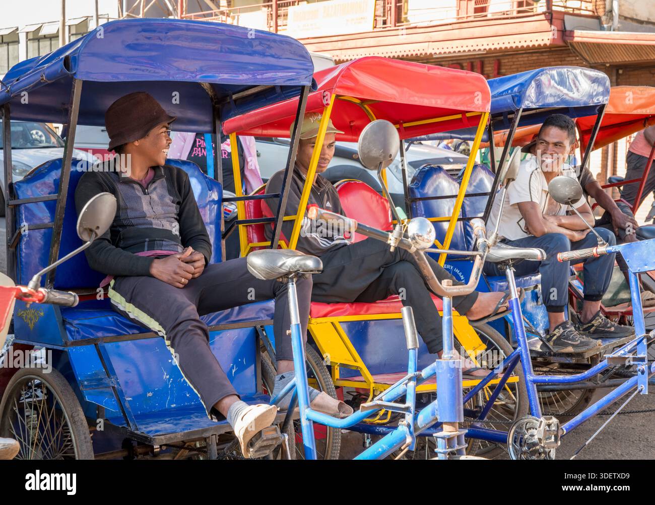 A group of cycle rickshaw drivers and their colorful cycle rickshaws ...