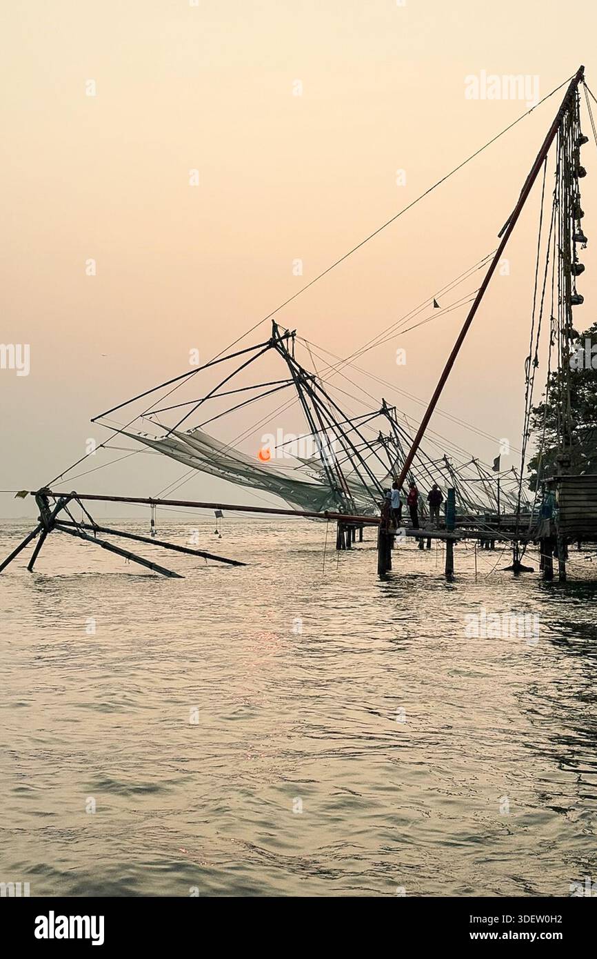 Traditional Chinese fishing nets line the waterfront in Kochi, Kerala ...