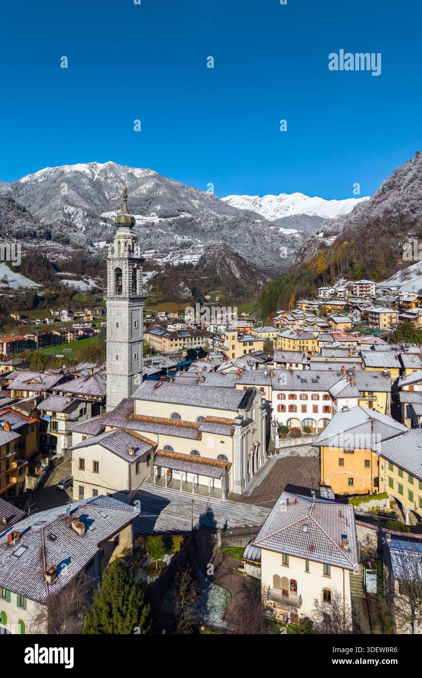 Aerial view of the beautiful village of Ardesio in winter after a snowfall. Ardesio, Orobie alps, Lombardy district, Bergamo province, Italy, Europe. Stock Photo