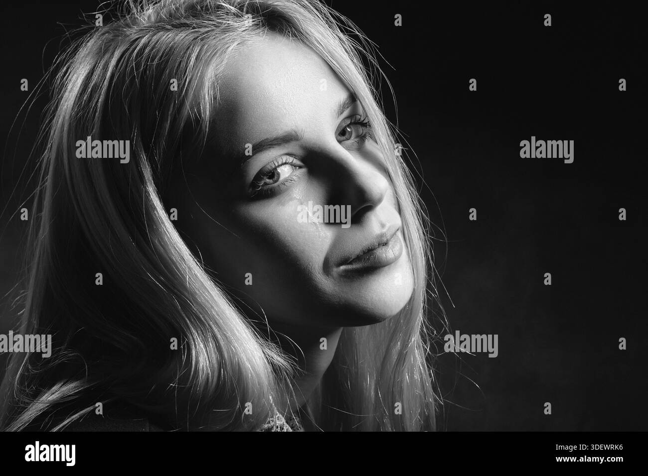 Sad girl crying on black background, monochrome Stock Photo - Alamy