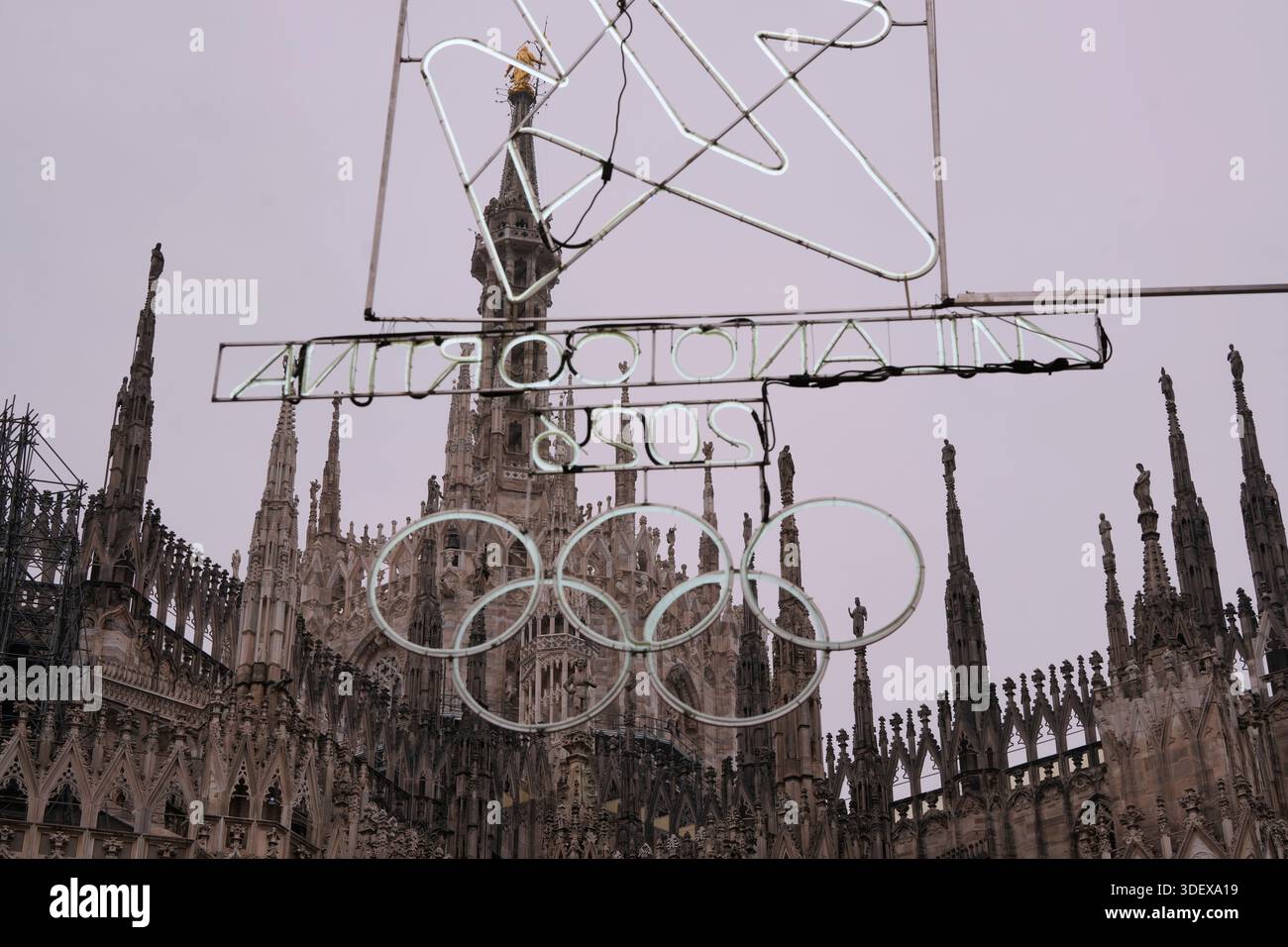 Olympic Iconic neon rings hang next to the Duomo gothic cathedral for ...