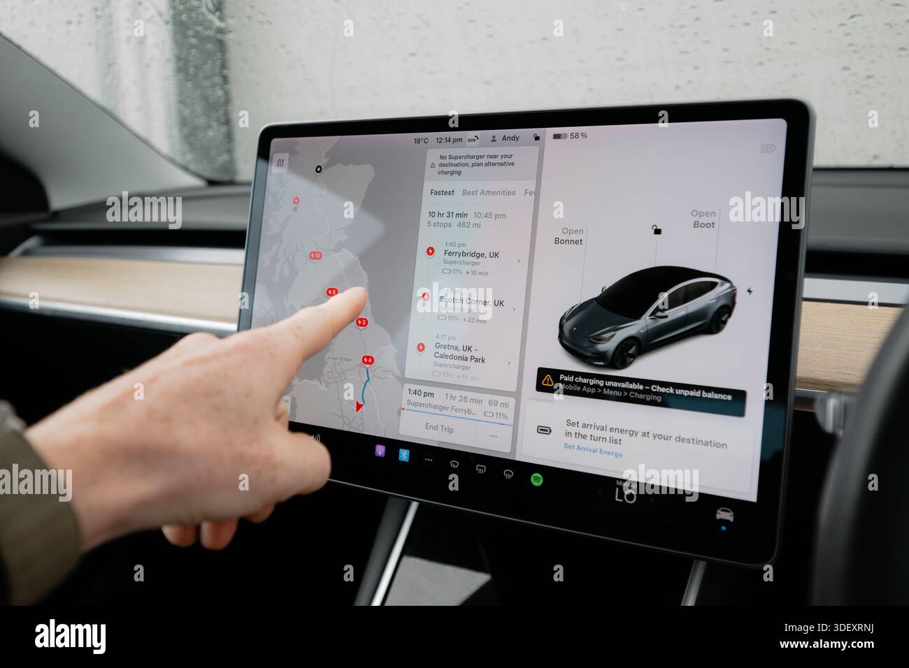 Tesla Distance Derby, UK - January 9th 2026: A driver uses a Tesla touchscreen to plan ...