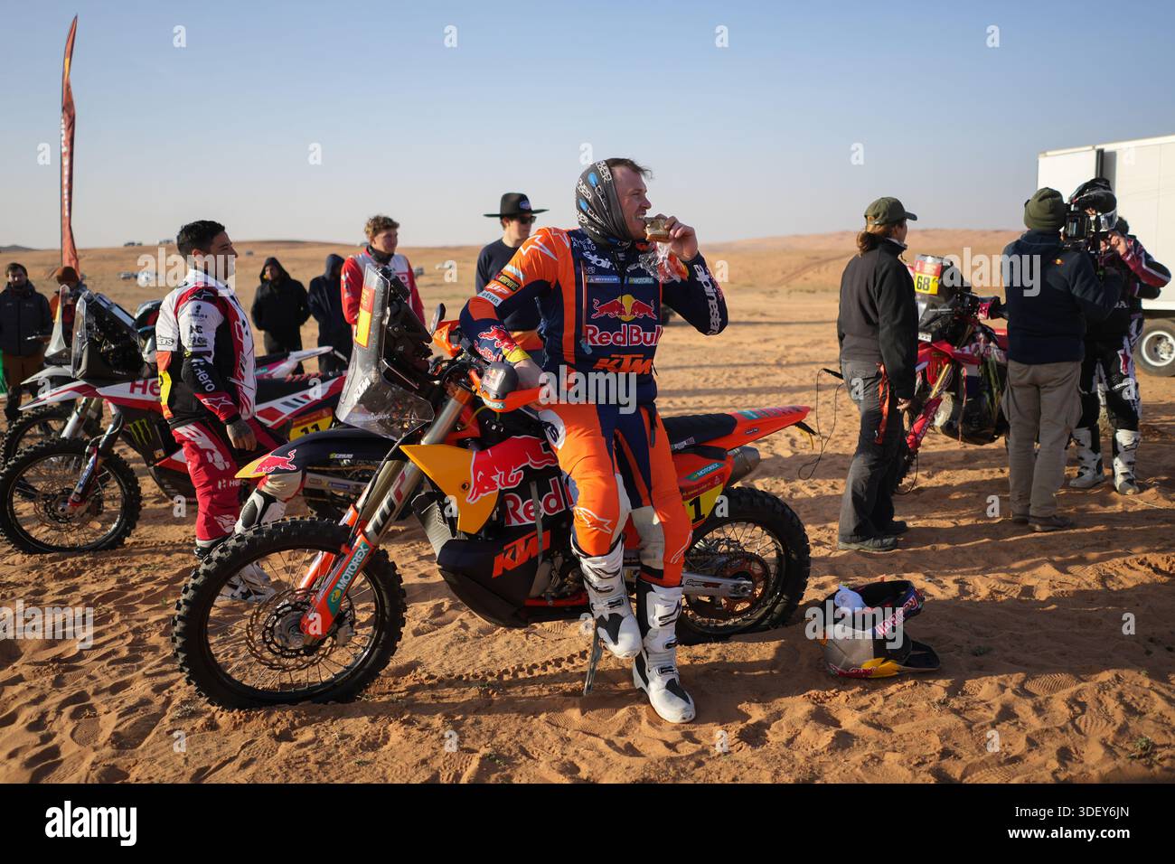 Sander Rider Rider Daniel Sanders eats a sandwich prior to the start of the sixth ...