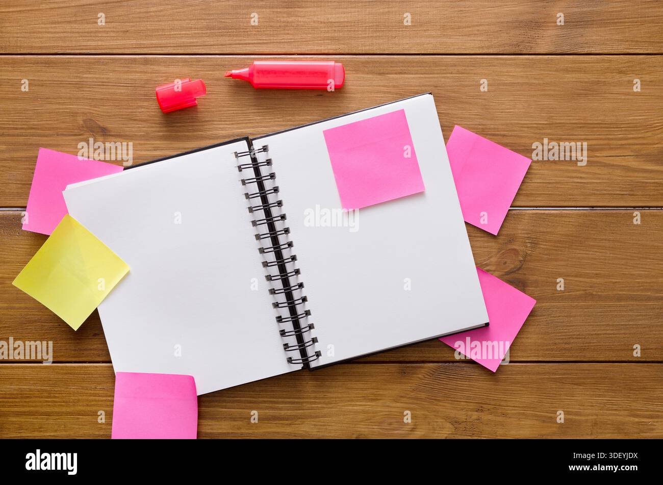 Workspace With Blank Notebook and Colorful Sticky Notes on Wooden Table for Brainstorming Ideas Stock Photo