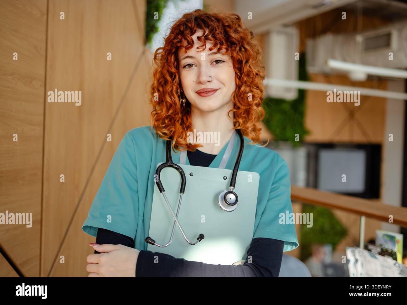 Young female nurse using smartphone on her break time Stock Photo
