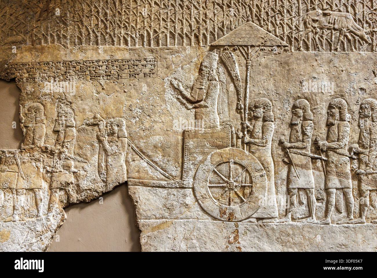 Assyrian chariot, part of a wall frieze, British Museum, London, England, UK Stock Photo