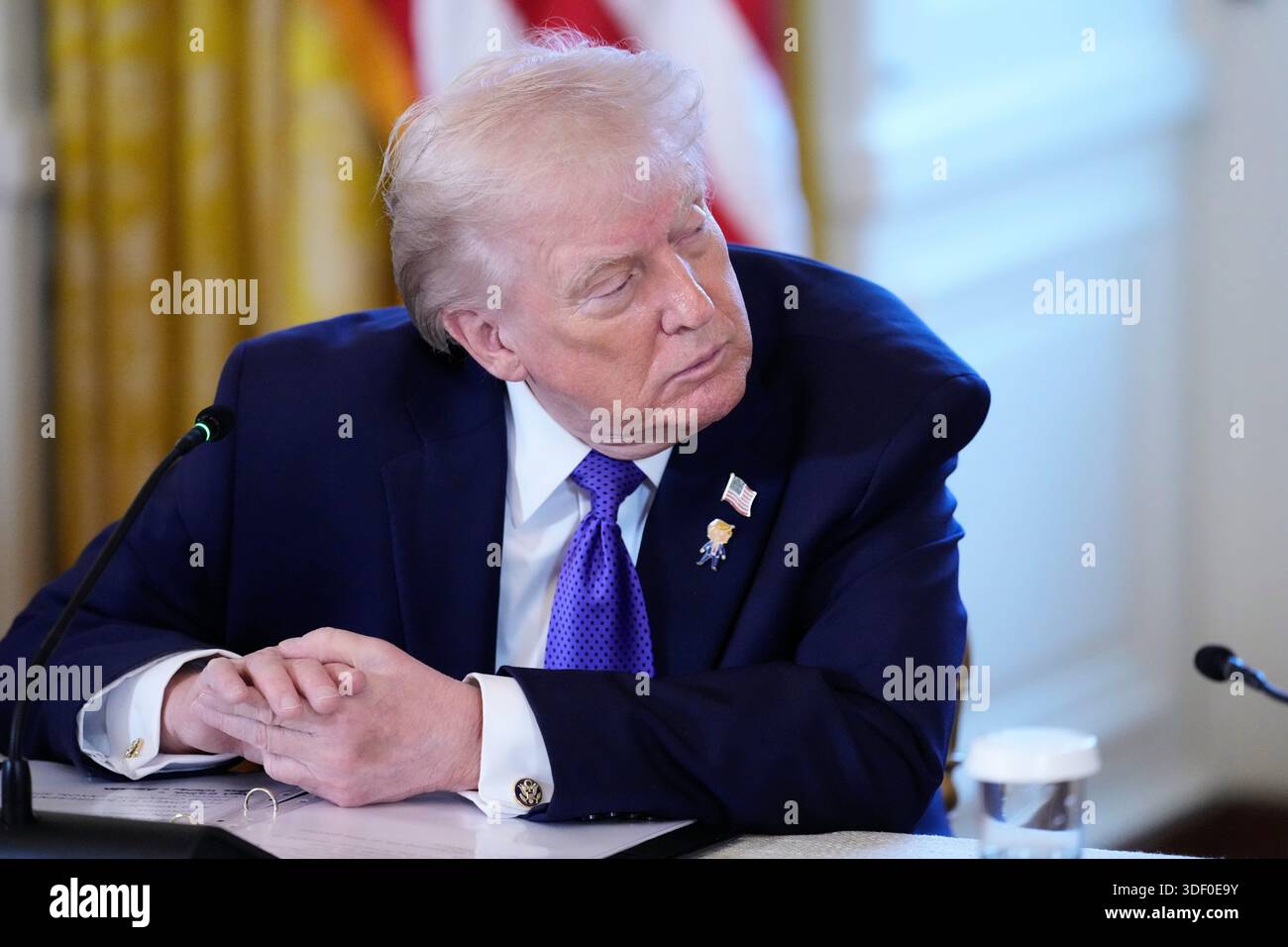 President Donald Trump listens during a meeting with oil executives in ...