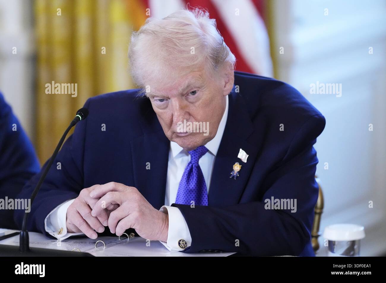 President Donald Trump listens during a meeting with oil executives in ...