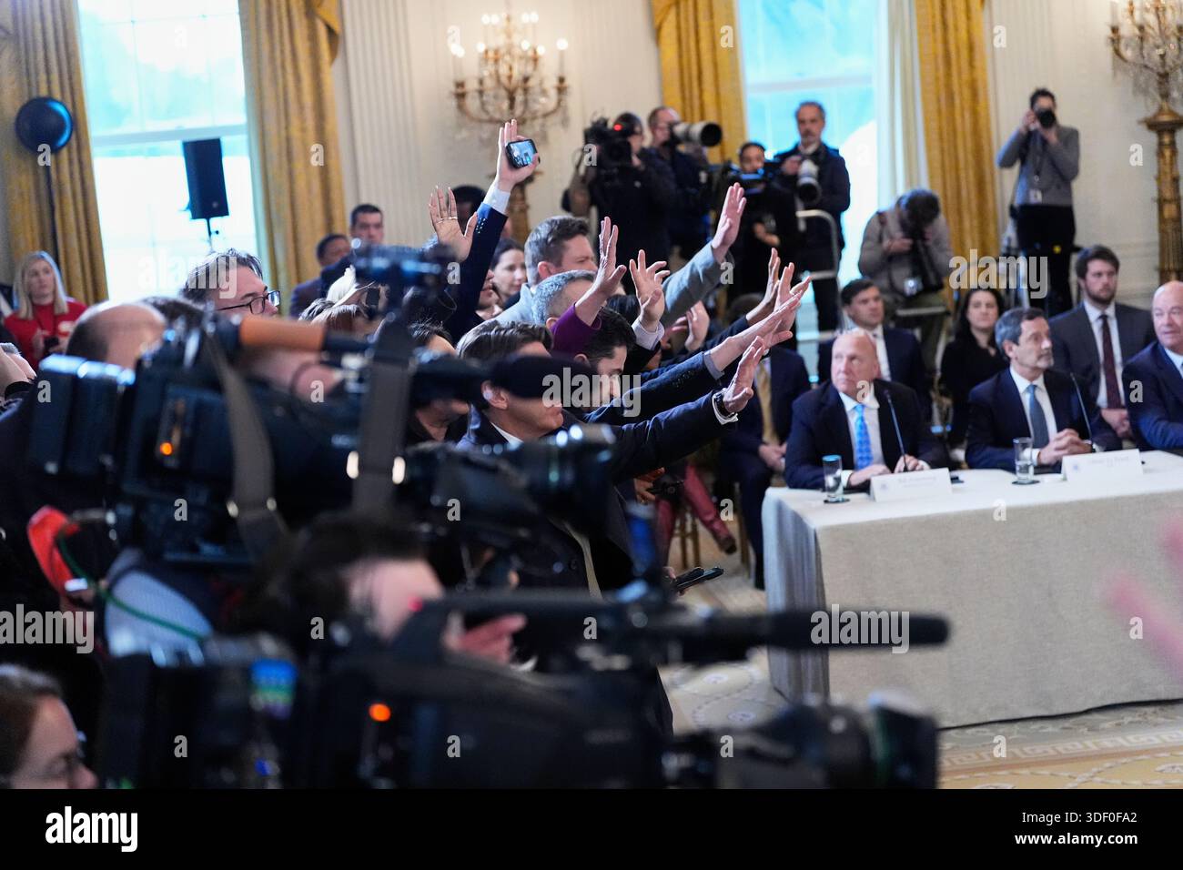 President Donald Trump takes questions from the media during a meeting ...