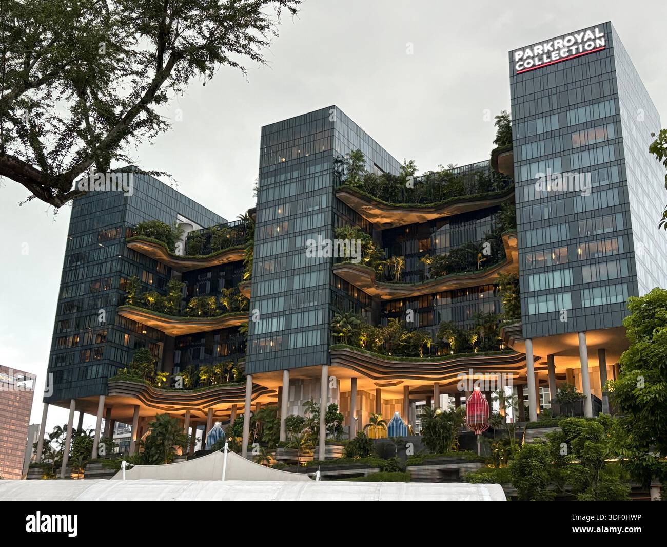 Singapore – a vibrant shopping and entertainment hub featuring modern architecture, greenery, and dynamic urban life - Smartphone Captured Stock Image