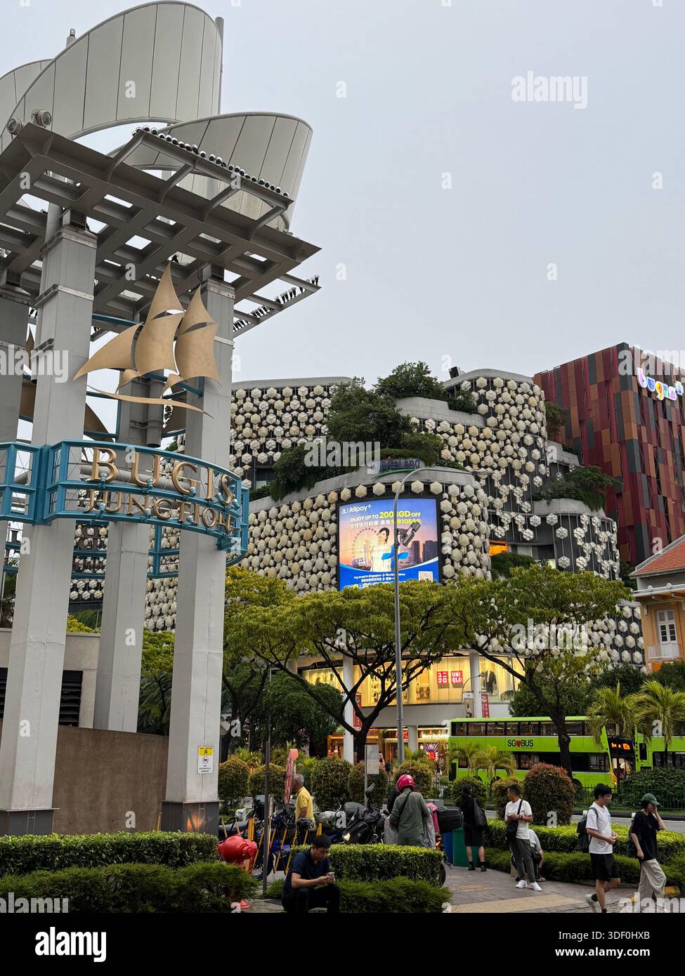 Singapore – a vibrant shopping and entertainment hub featuring modern architecture, greenery, and dynamic urban life - Smartphone Captured Stock Image