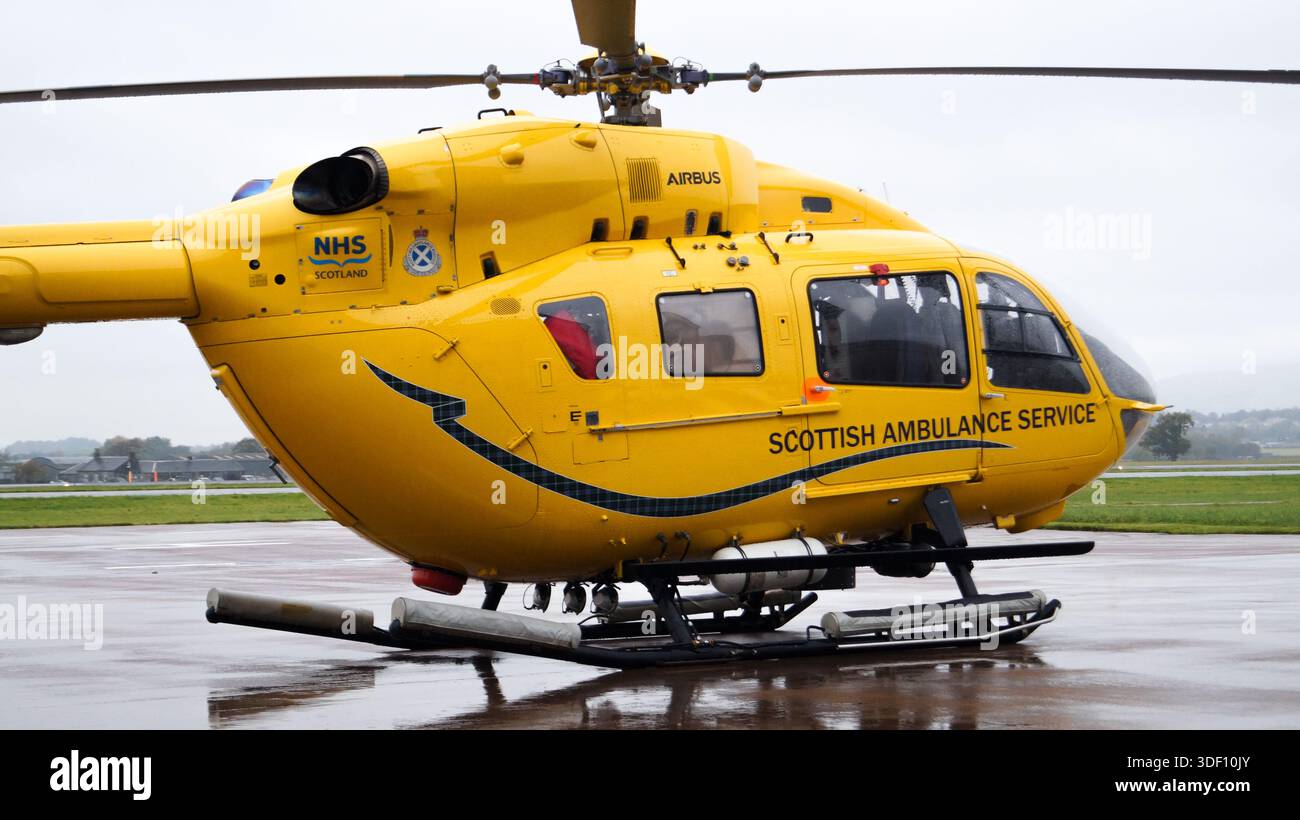 Scottish Ambulance Service (SAS) Air Ambulance Helicopter from the Emergency Medical Retrival Service (EMRS) seen on the ground at Glasgow Airport Stock Photo