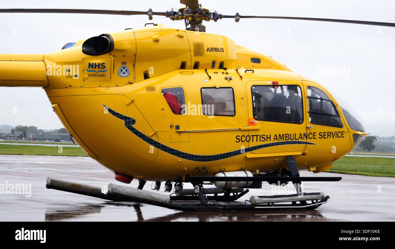 Scottish Ambulance Service (SAS) Air Ambulance Helicopter from the Emergency Medical Retrival Service (EMRS) seen on the ground at Glasgow Airport Stock Photo