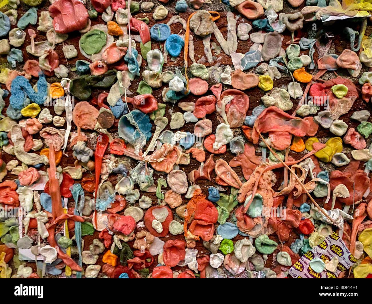 multiple gum stuck on wall in the notorious gum wall in Seallte, Washington, USA Stock Photo