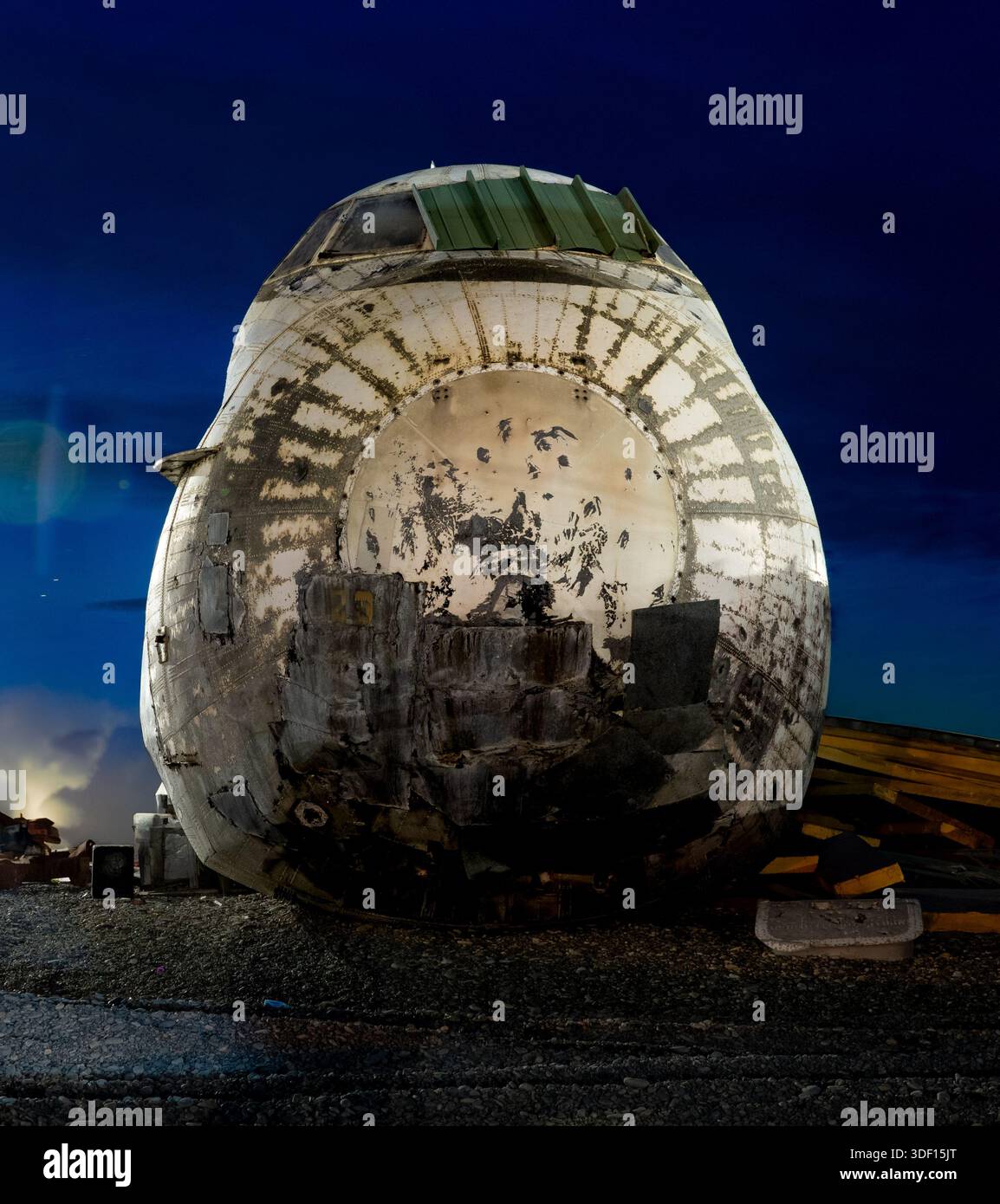 Light Aircraft Rusting Rusted and repurposed airplane fuselage and cockpit at night Stock ...