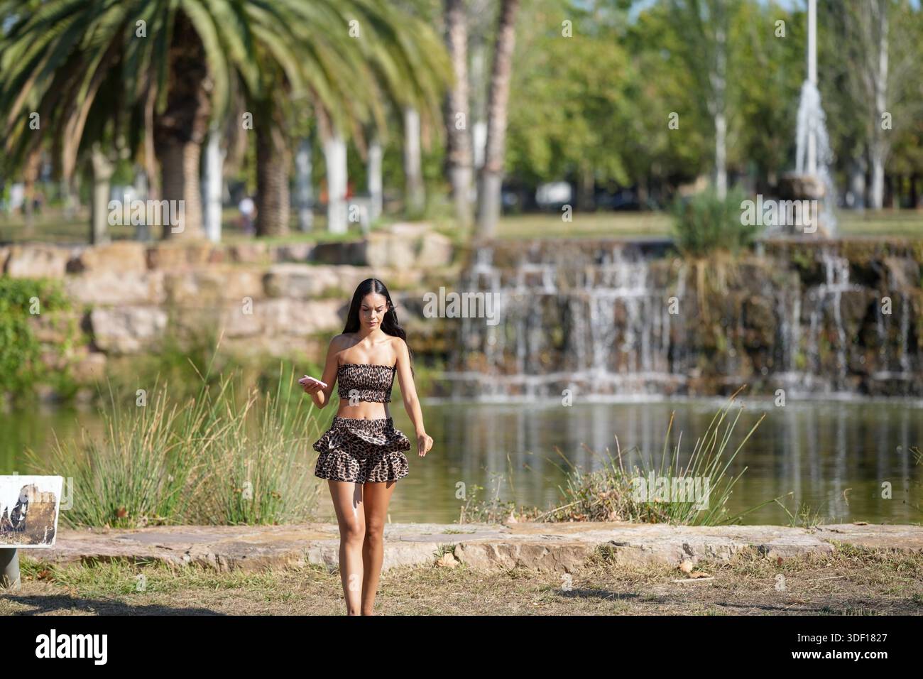 Woman in short skirt walking hi-res stock photography and images - Alamy