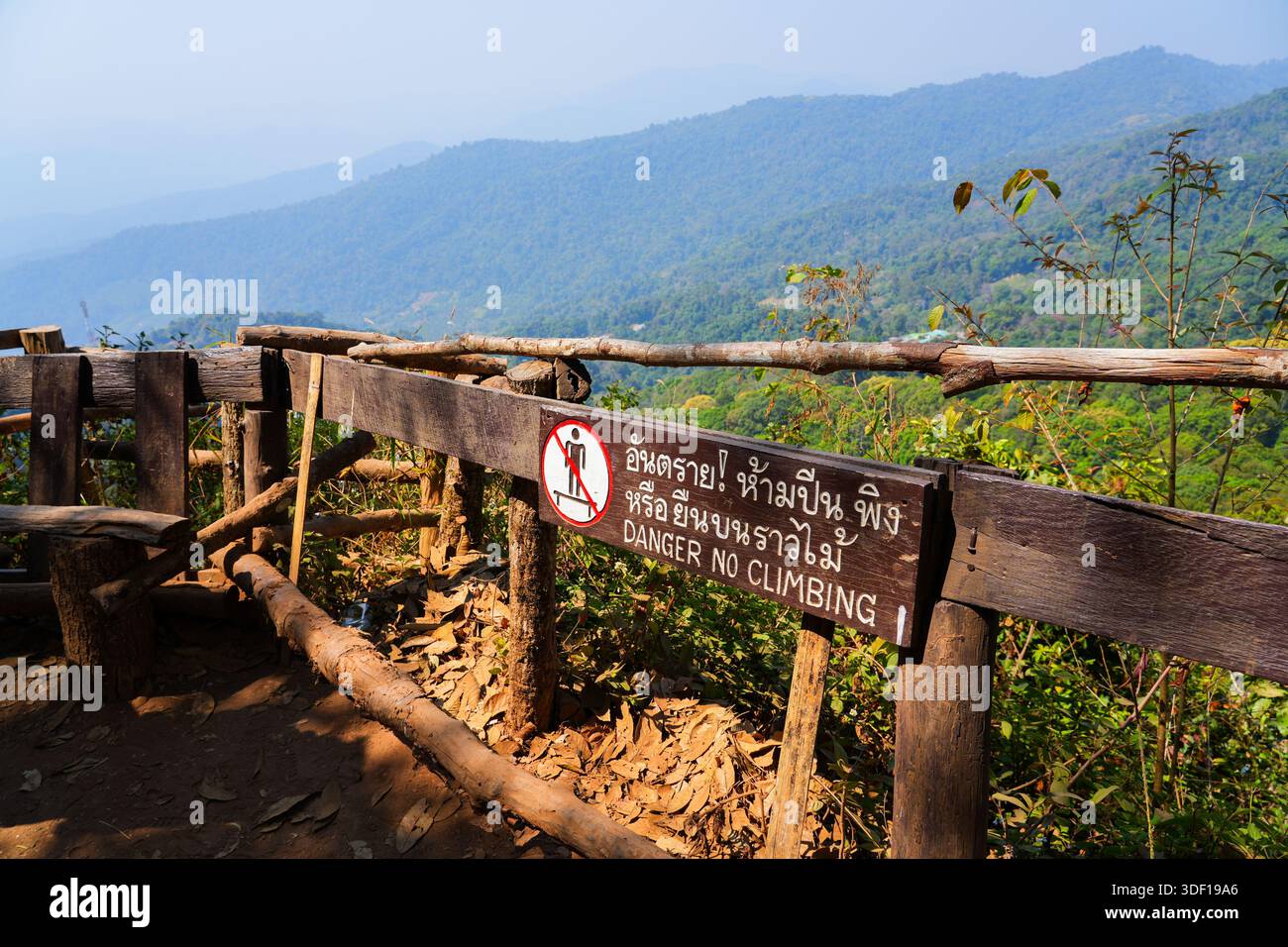 Overlooking Sign Rustic mountain lookout with a traditional warning sign overlooking the ...