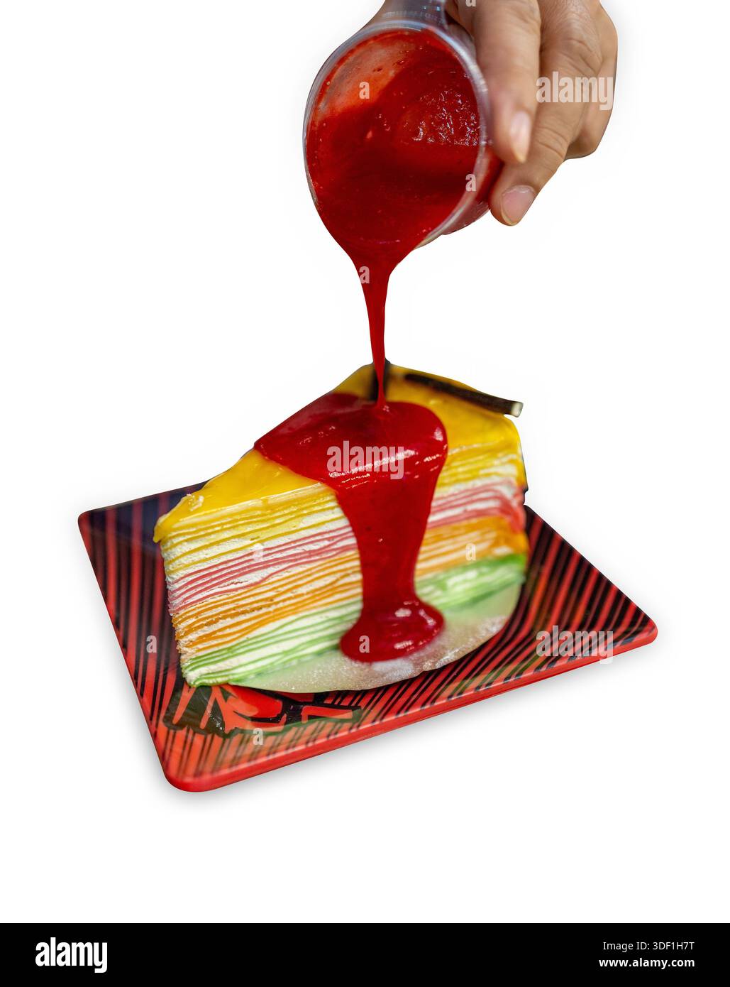 Die cut of rainbow crepe cake on white isolated. Stock Photo