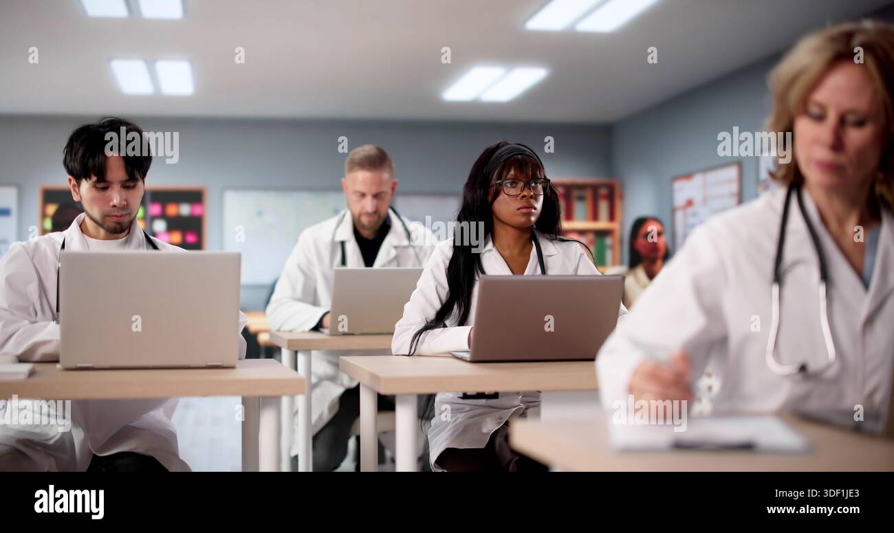 Diverse Medical Students Using Laptops To Learn Technology In University. Stock Photo