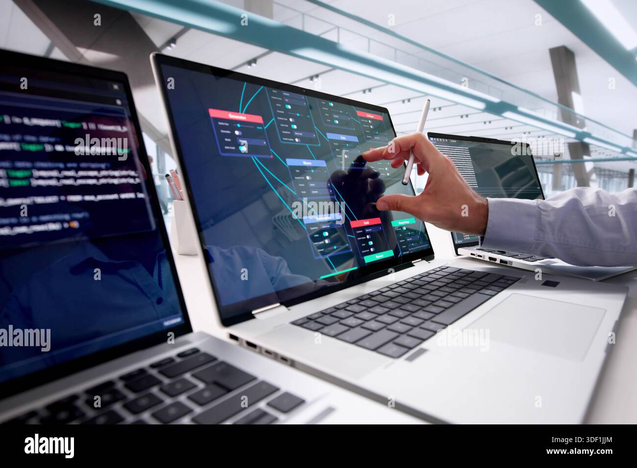 Professional Programmer Using Node Editor For Visual Scripting And Training Stock Photo