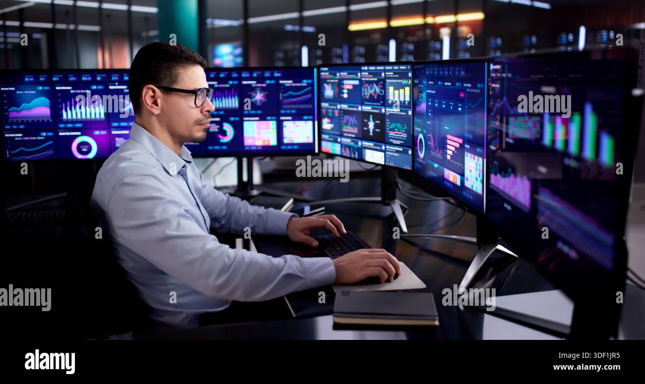 Hispanic Data Analyst Analyzing KPIs On Business Desktop Dashboard Stock Photo