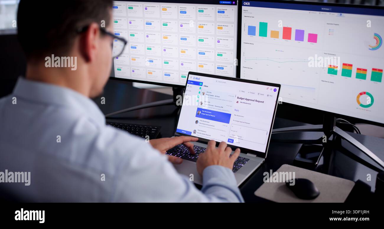 Young Hispanic Man Working On Computer, Checking Screen For Business Emails. Stock Photo