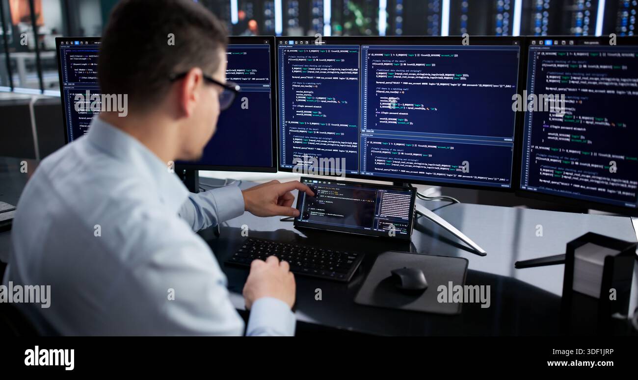 Hispanic Programmer Developing Software On Mini Computer For Data Analysis. Stock Photo