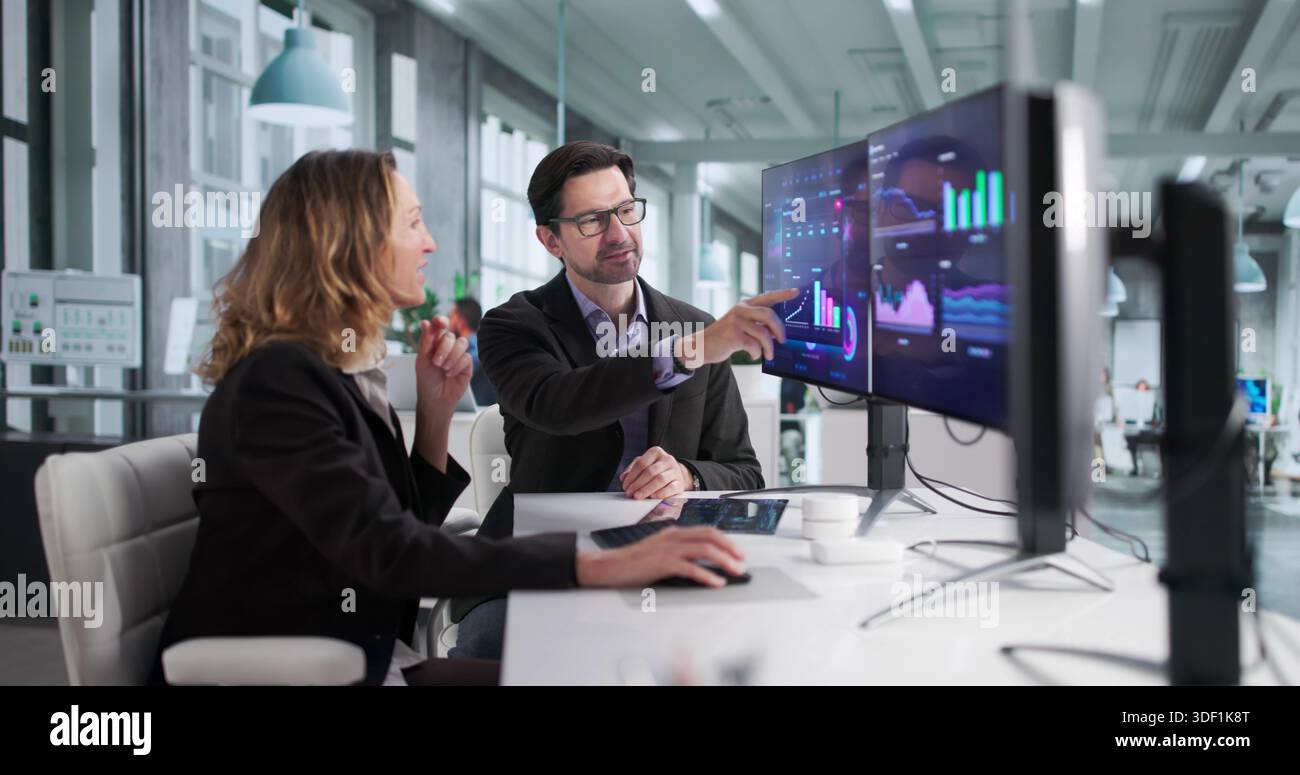Focused Financial Analysts Analyze Computer Dashboard For Top ...