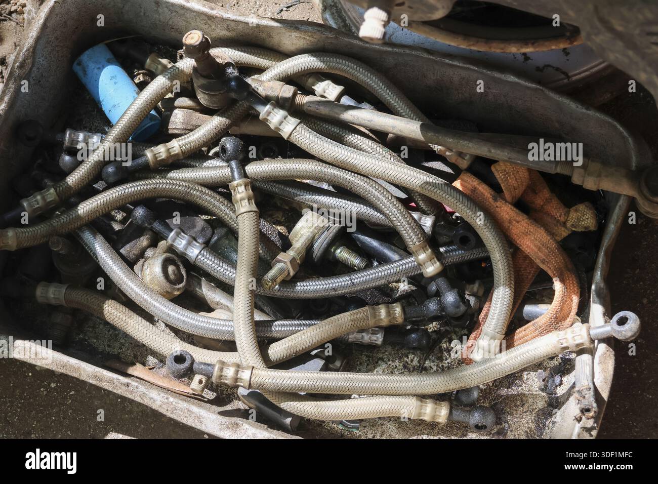 Pile of disorganized automotive hydraulic hose, pipe, tube, rubber part ...