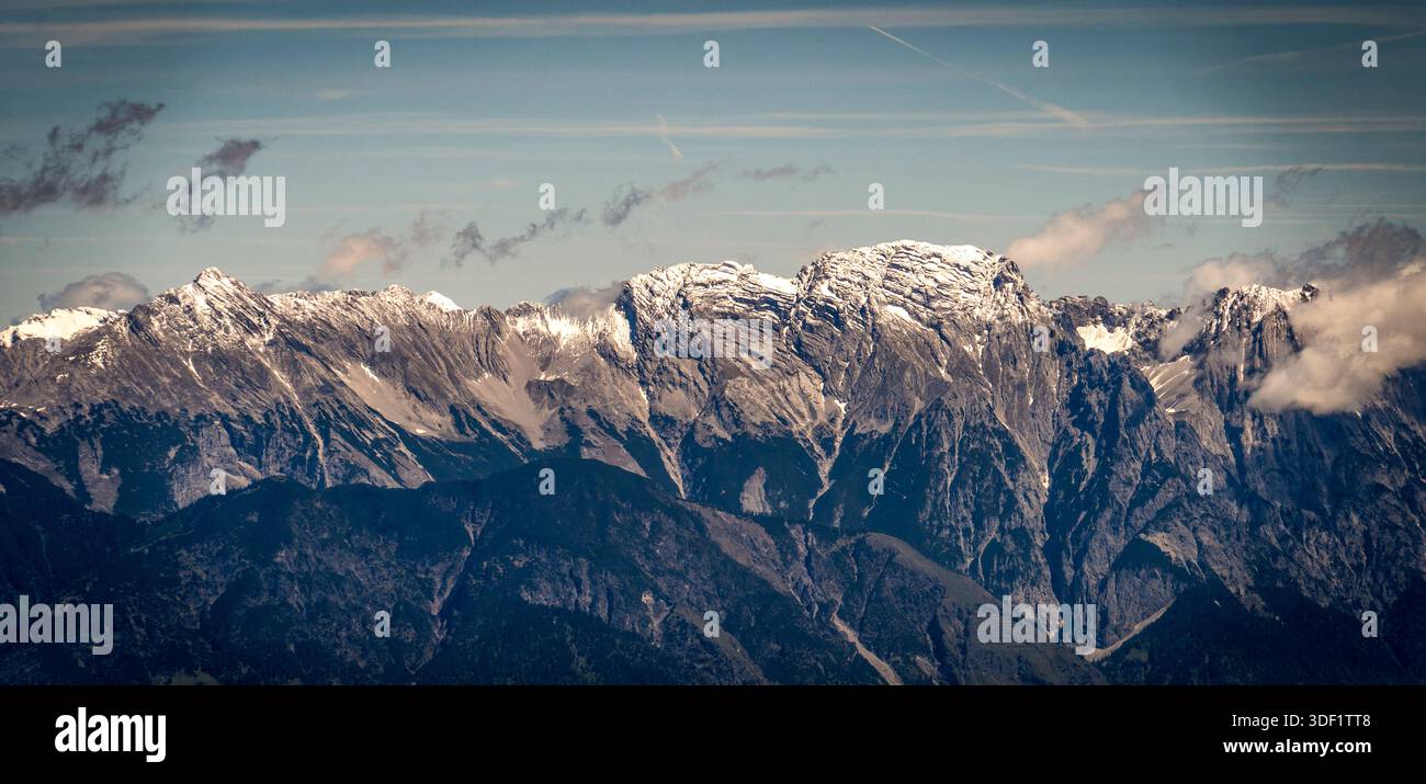 Snow-capped mountain range under a clear blue sky. Stock Photo