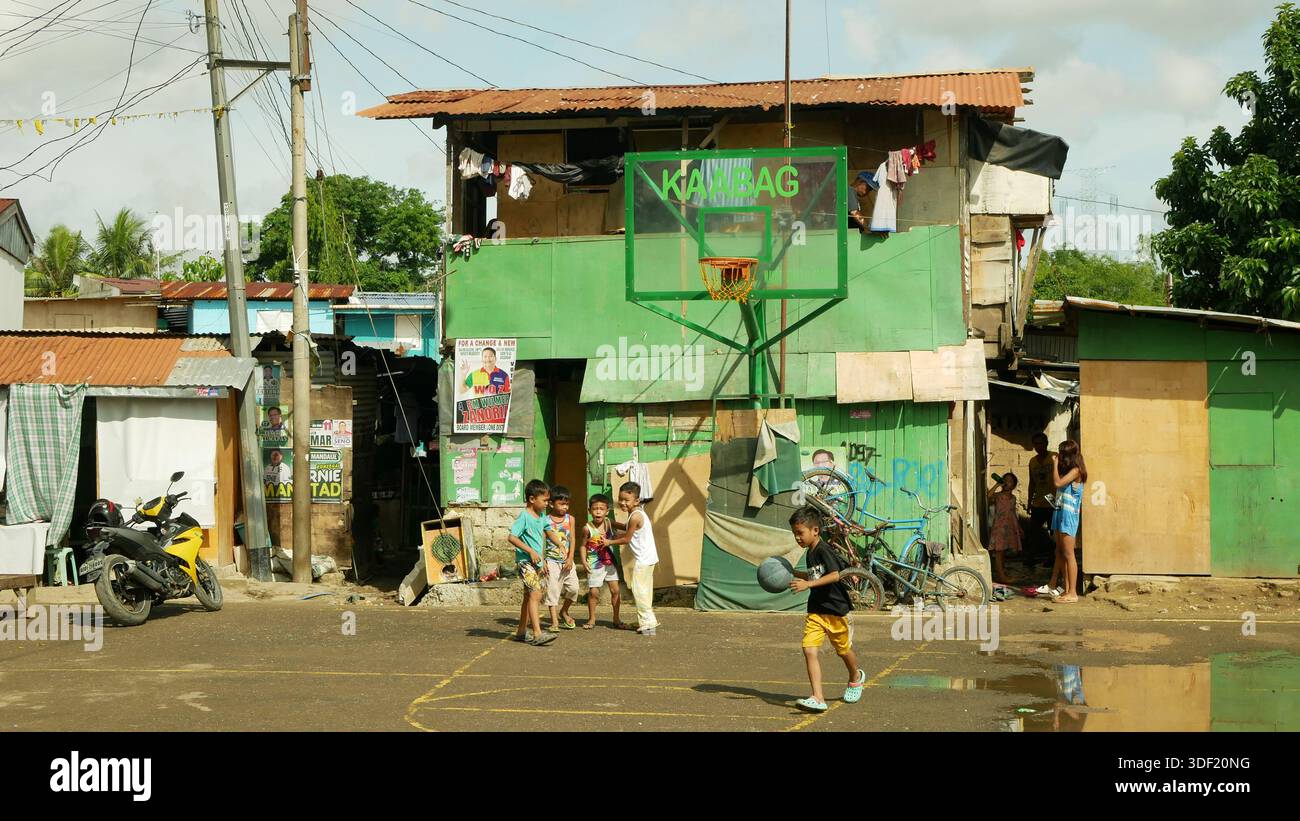MANDAUE CITY, PHILIPPINES, MAY 28, 2025: Poor homeless children ghetto ...