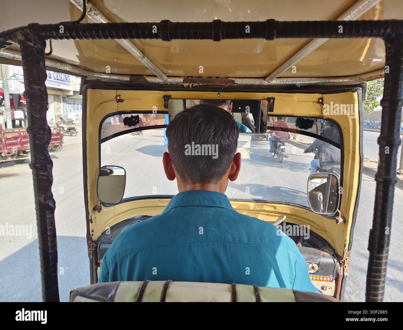 Karachi, Pakistan - December 14, 2025: Autorickshaw driver from the ...