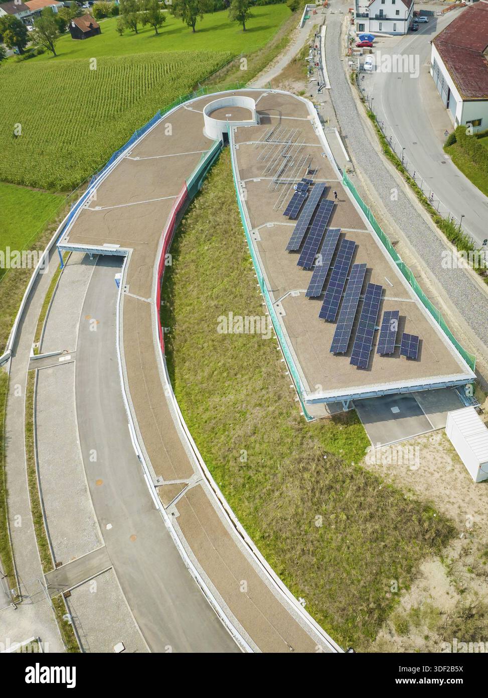 Solar Plan Ride Round road layout next to solar panel system on a roof, new Park and ...