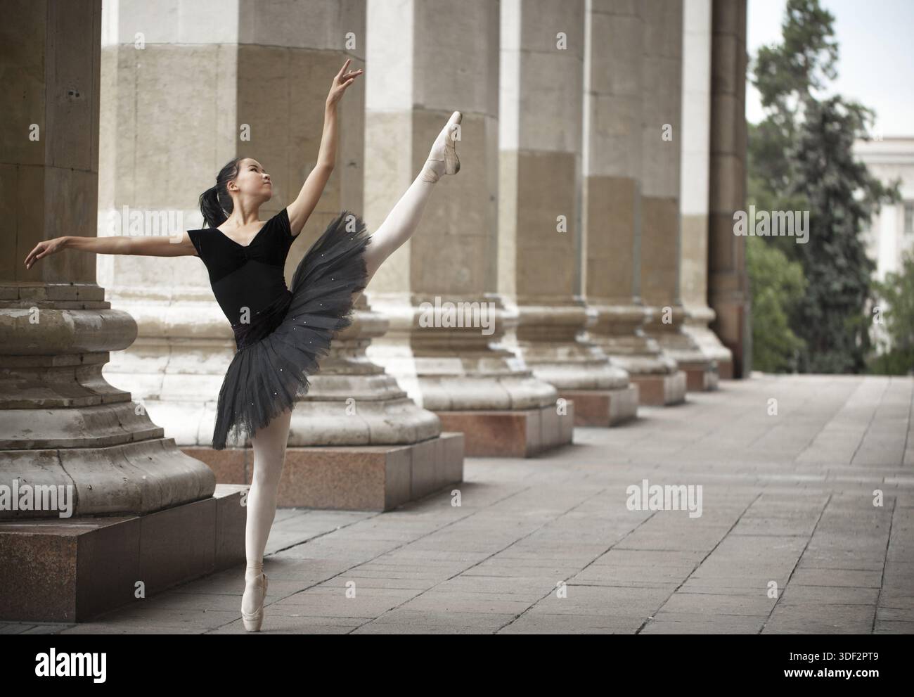 Girl ballerina flats standing on tiptoes on the street Stock Photo - Alamy
