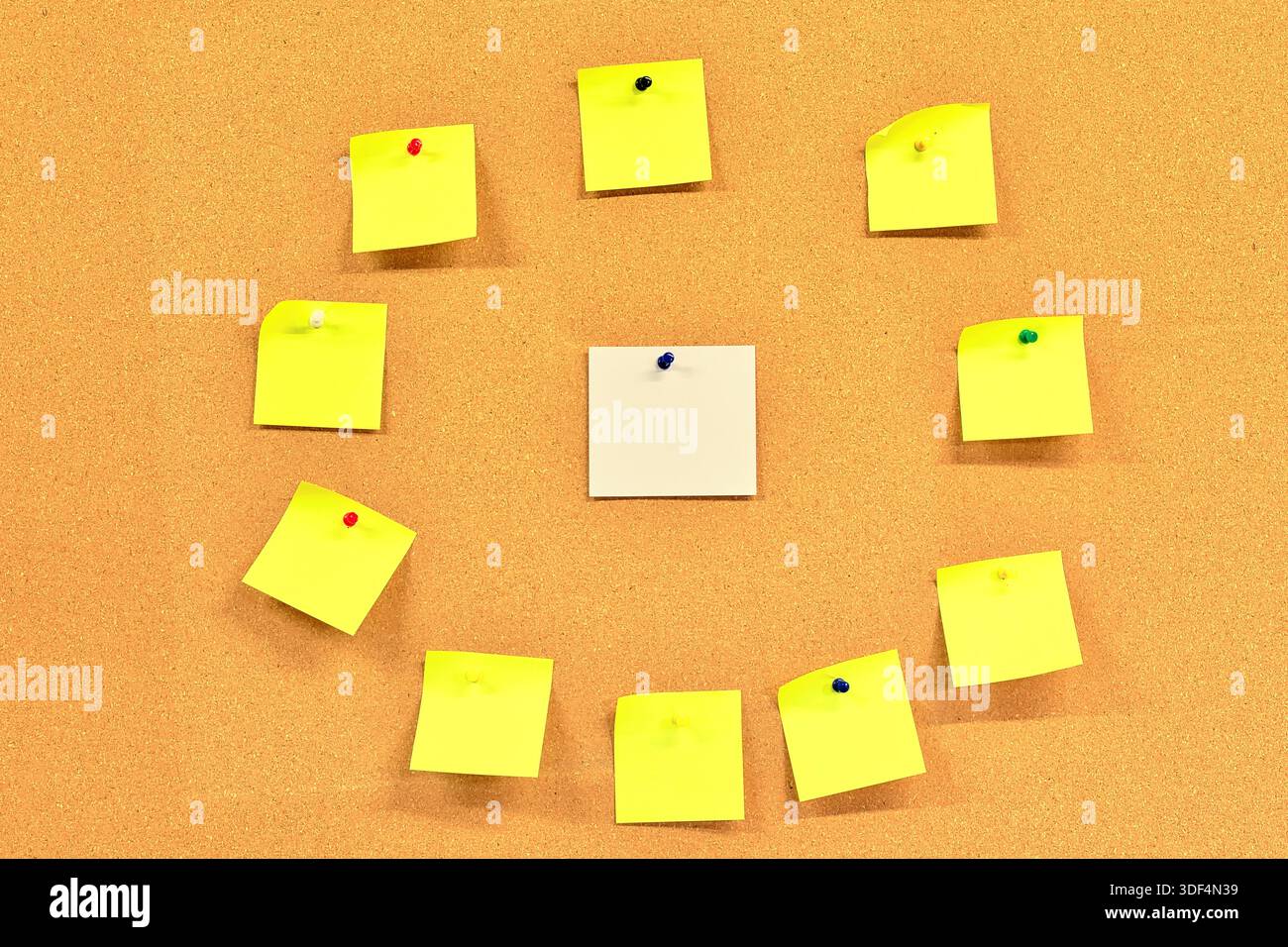 Blank white square note paper with yellow square blank note papers around it. Stock Photo