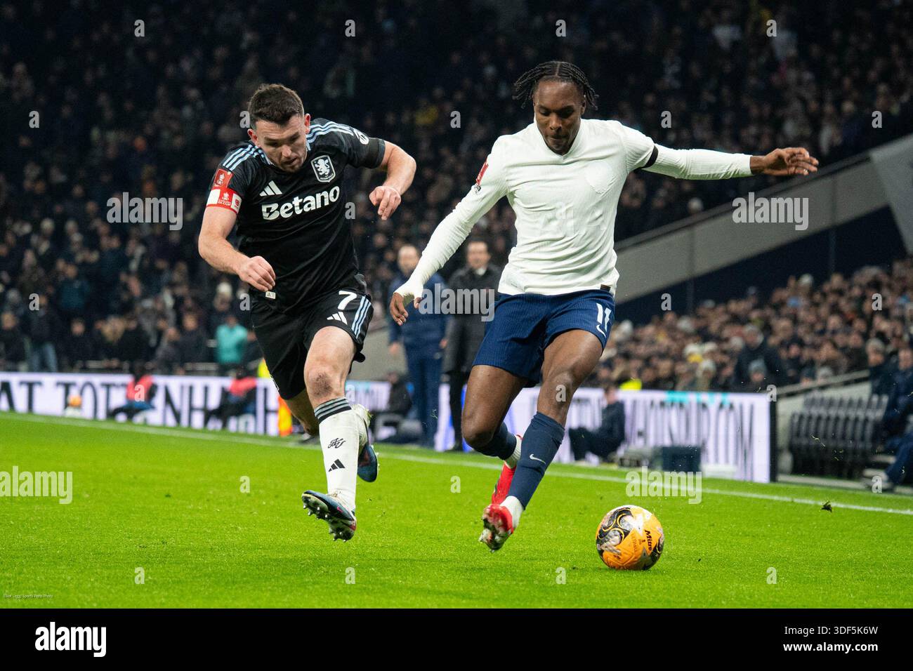 Mathys Tel (R) taking on John McGinn (L), Tottenham Hotspur v Aston ...