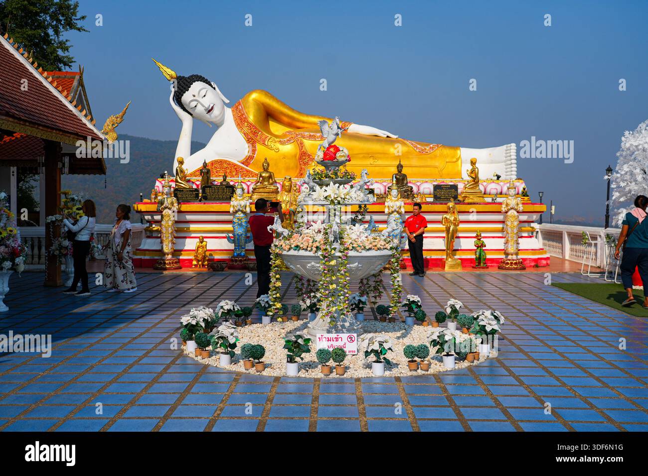 Magnificent giant reclining Buddha statue at Wat Phra That Doi Kham ...
