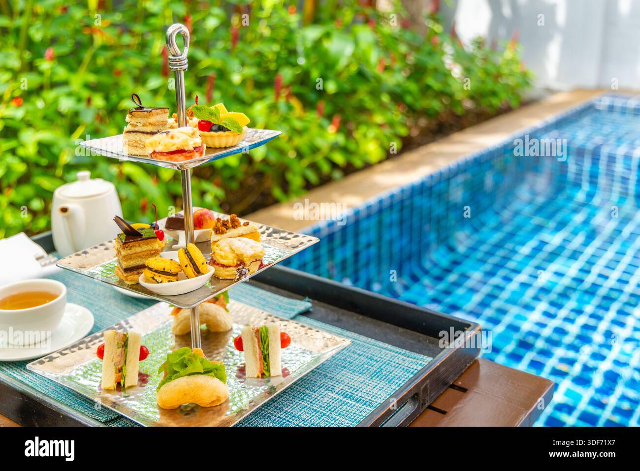 Pool Side Hi Tea Afternoon tea set by pool with sandwiches and pastries, poolside ...