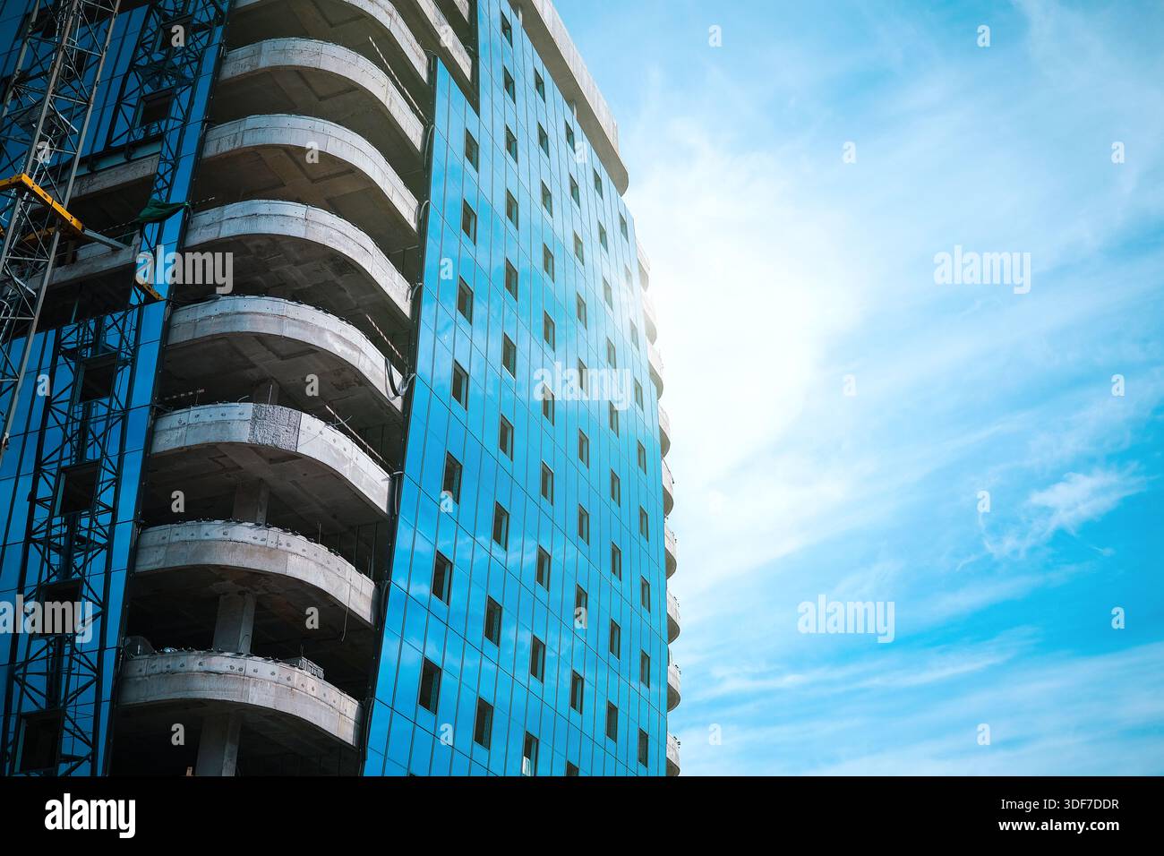 Tall modern building being built from concrete Stock Photo