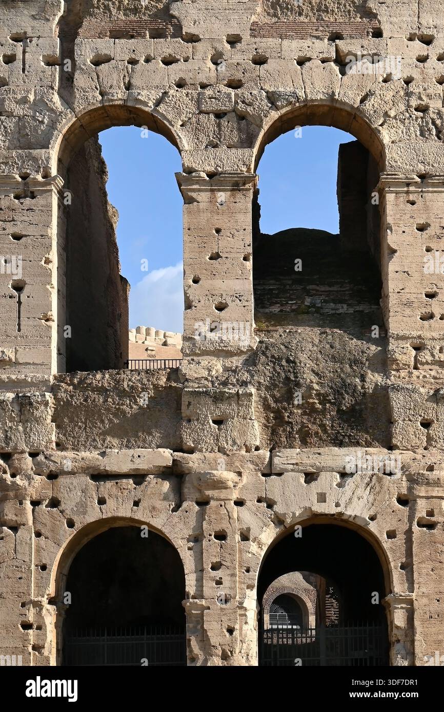 Exterior of colosseum amphitheatre with historic roman archways ...