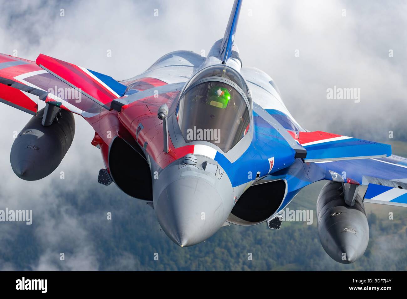 The photograph presents a head-on, close-up view of a French Air Force ...