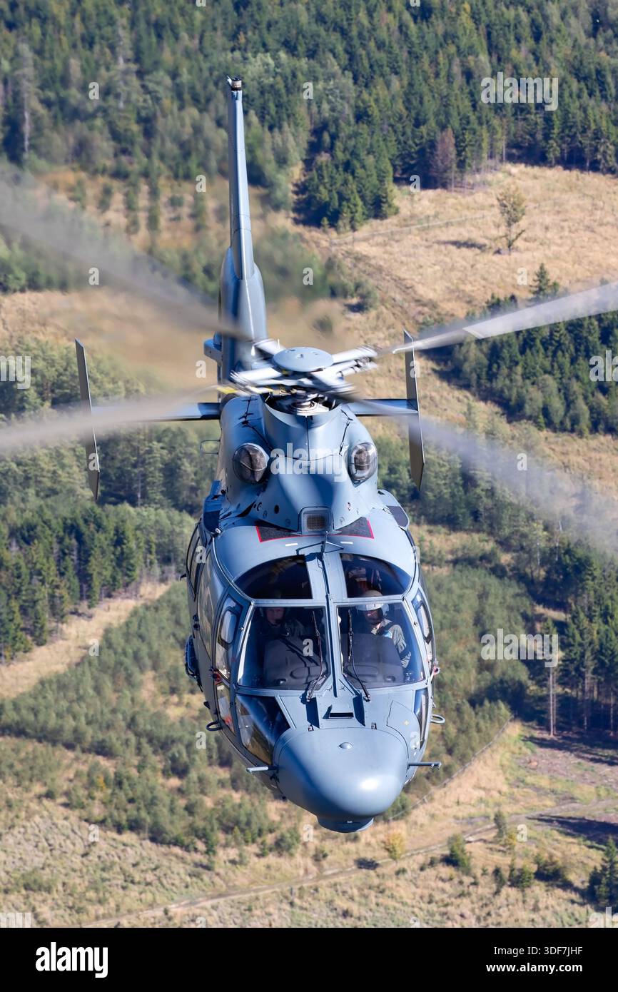 The image shows a Lithuanian Air Force search and rescue helicopter ...