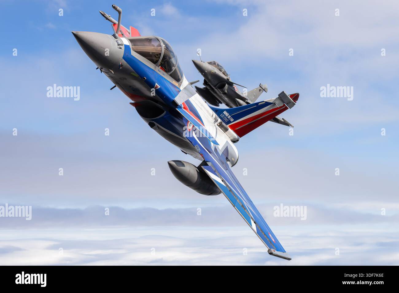 This photograph captures two French Air and Space Force Dassault Rafale ...