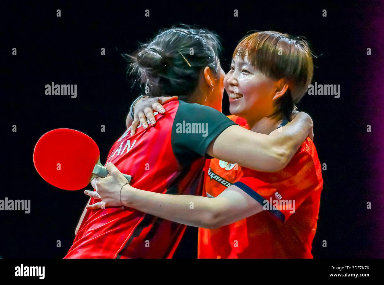 Doha, Qatar. 11th Jan, 2026. Zhu Yuling (R) of China's Macao hugs Han ...
