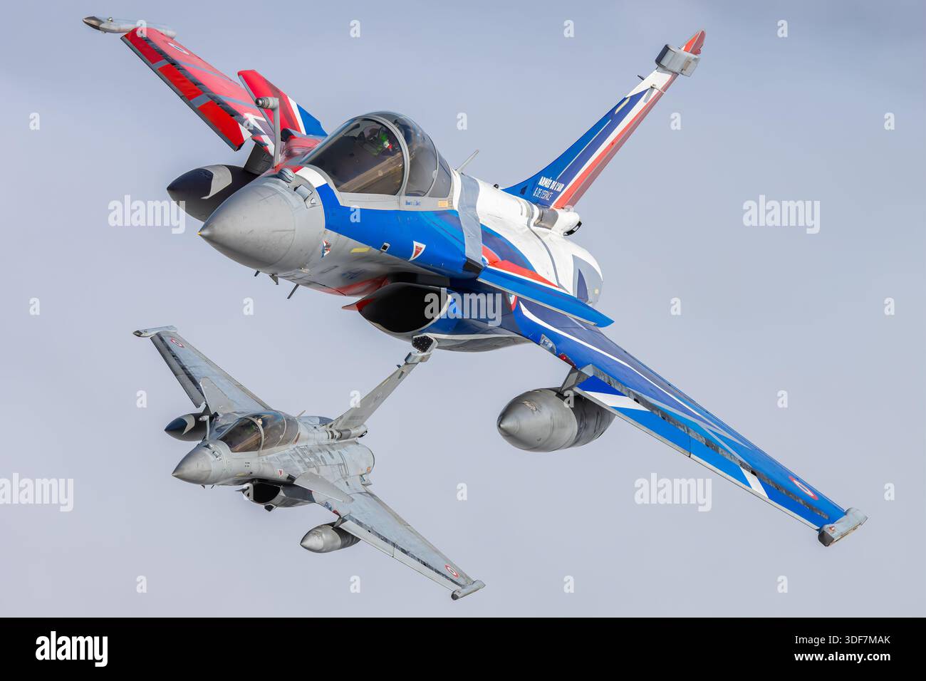 Two French Air Force Dassault Rafale aircraft are photographed in close ...