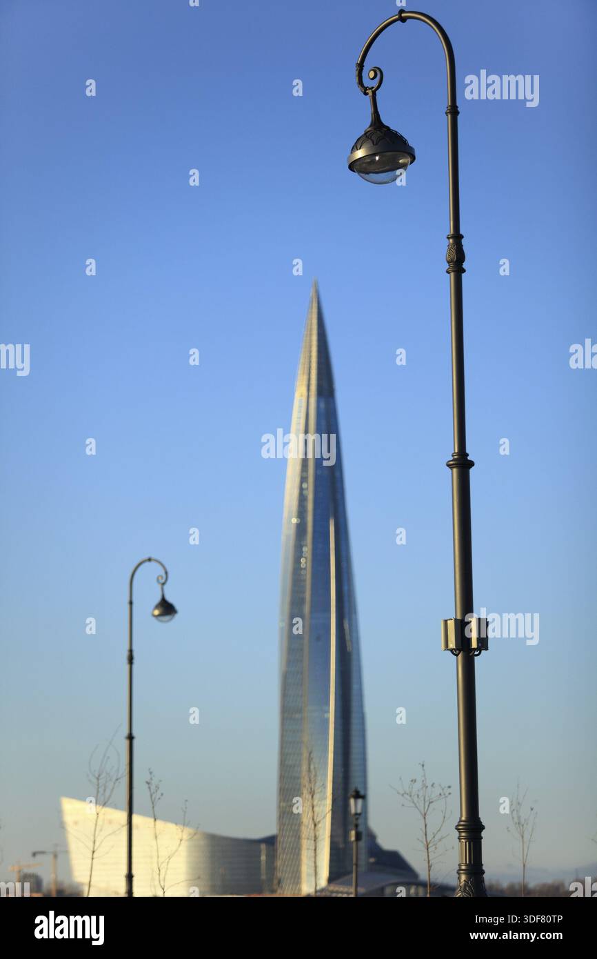 High lamppost above skyscraper, low angle Stock Photo