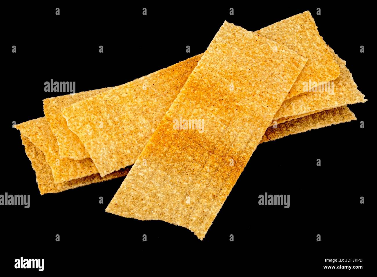 Long chips isolated on black background, rectangular mashed potato snacks, package design element Stock Photo