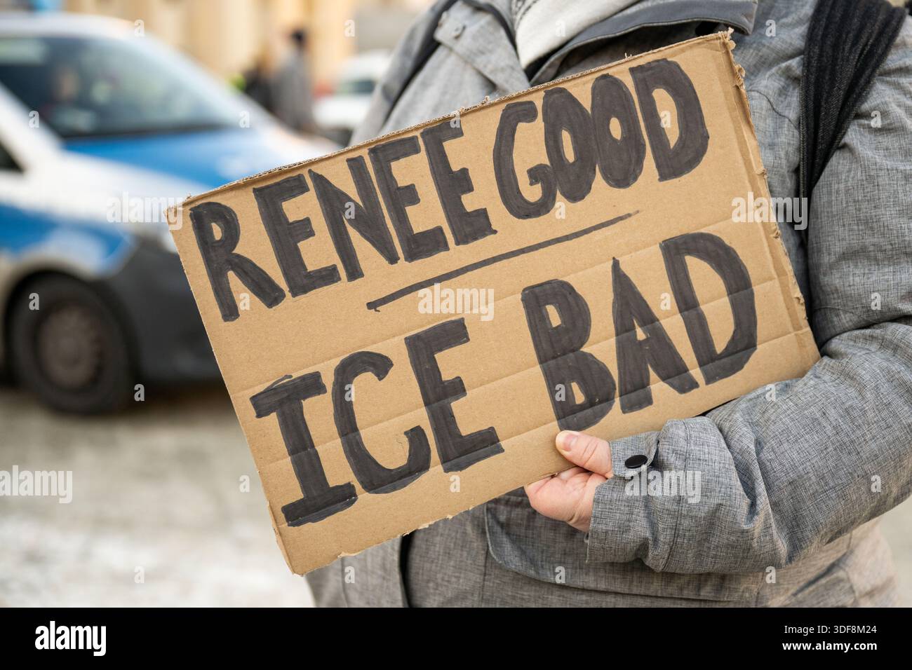 11 January 2026, Berlin: A participant in a vigil for the shot American ...