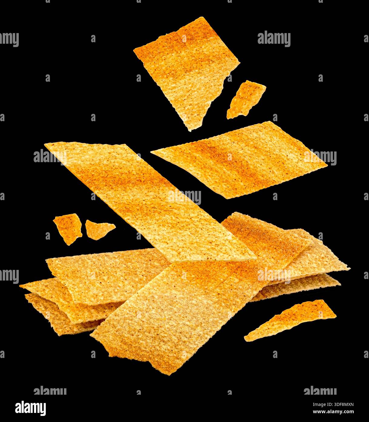 Falling long chips isolated on black background, rectangular mashed potato snacks, package design element Stock Photo