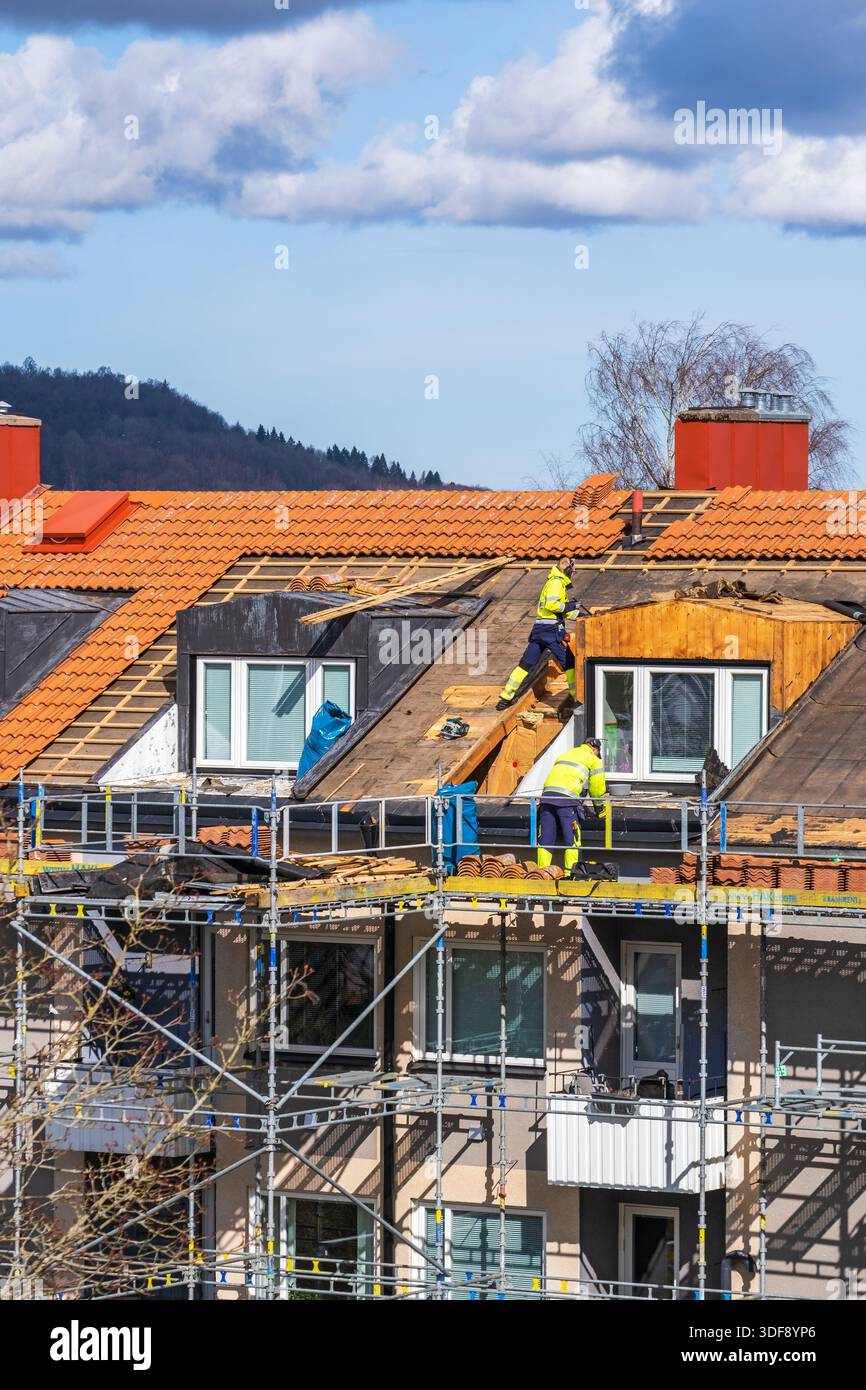 Work on a roof with scaffolding Stock Photo